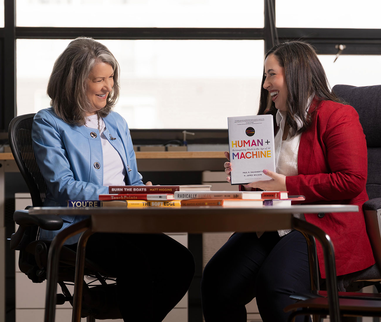 Barbara Caraballo and Carolyn Monaco discussing a book